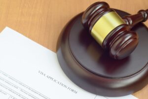 Justice mallet and Visa application form close up
