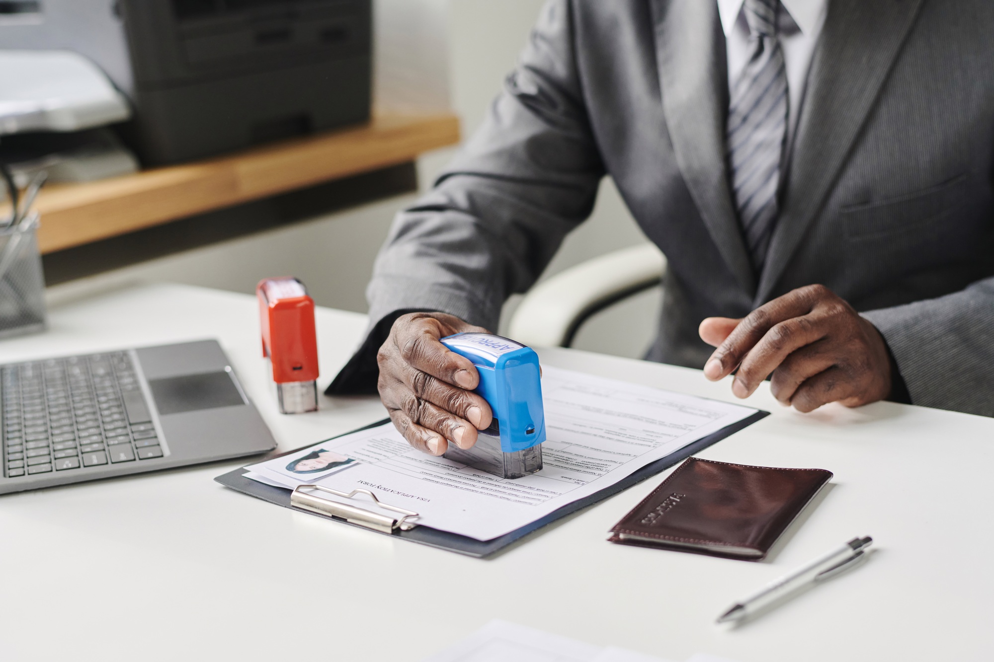 Man approving visa for tourists