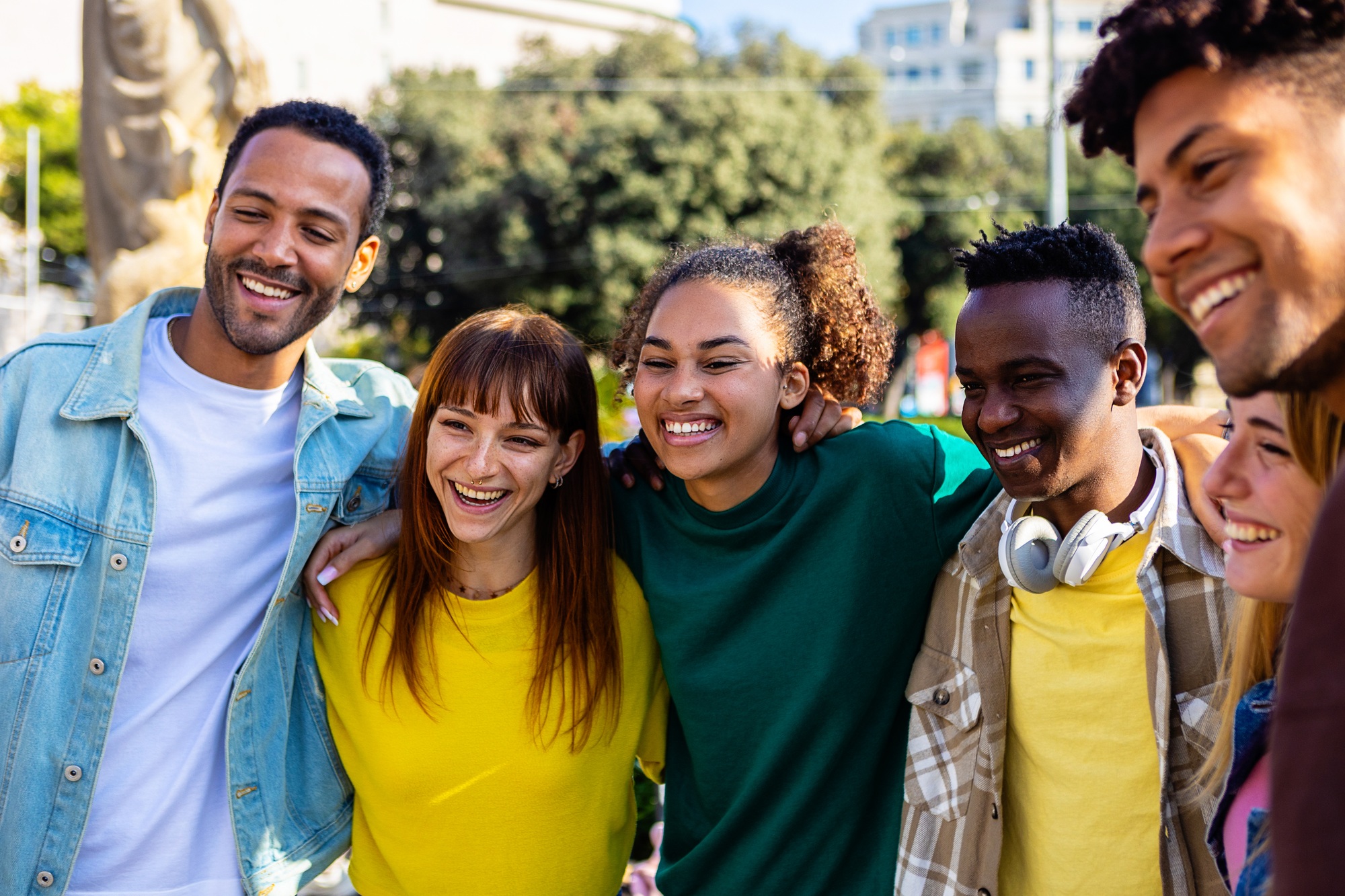 United multiracial young group of college students standing together outdoor